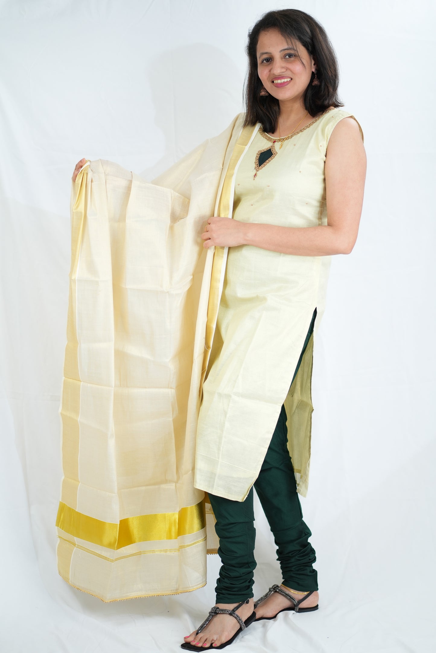 Golden Kasavu tissue churidhar with green bottom - 125