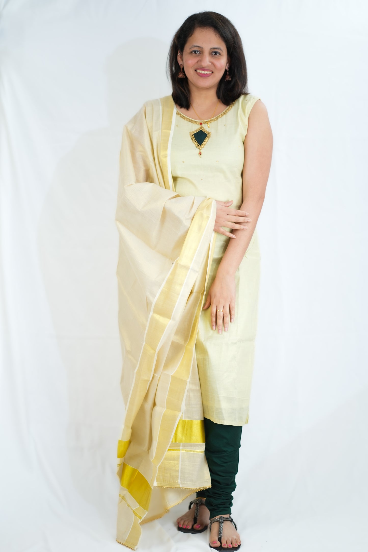 Golden Kasavu tissue churidhar with green bottom - 125